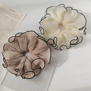 Elegant pleated chiffon hair scrunchies in cream and pink with black wavy edges