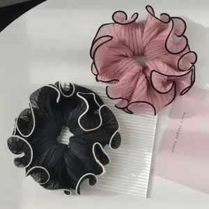 Elegant large pleated chiffon scrunchies in pink and black with contrast wavy edges