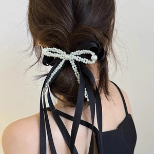 Elegant black satin bow hair tie with white pearl beads for high ponytail styles