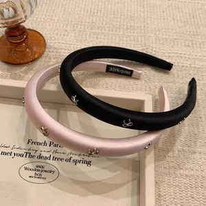 Satin padded headband set with metal bows in black and pink for a high skull top style