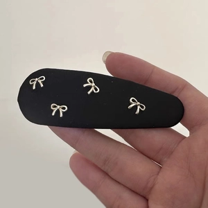 Elegant black fabric BB hair clip with silver bow accents for women stylish hair accessory