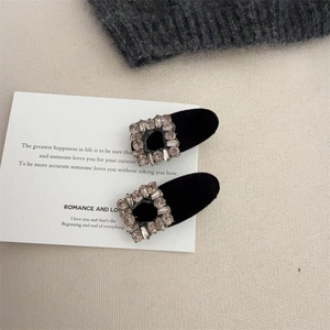Elegant pair of black velvet hair clips with rhinestone square buckles in a luxury style