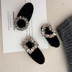 Detailed view of three velvet hair clips with rhinestone heart and geometric shapes