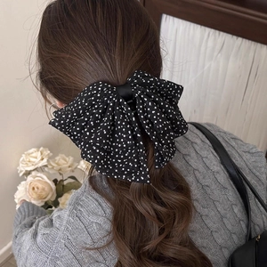Polka dot organza bow hair claw clip for women back view on ponytail hair accessory