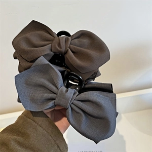 Set of two matte fabric bow hair claws in deep coffee and grey blue for elegant styling