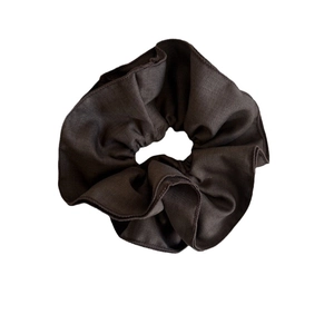 Solid dark brown scrunchie with thick fabric folds for buns and ponytails