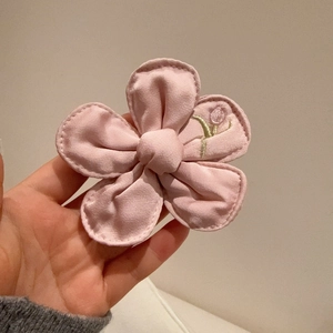 Pink fabric flower hair clip with tulip embroidery for kids in a minimalist Korean style