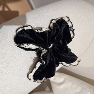 Elegant black velvet scrunchie with cream lace trim for French Hepburn style hairstyles
