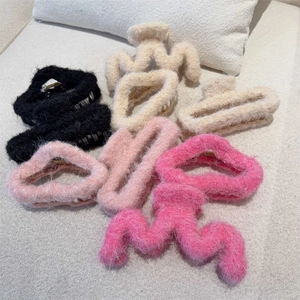Pink and neutral plush faux fur hair claw clips in assorted shapes for autumn and winter