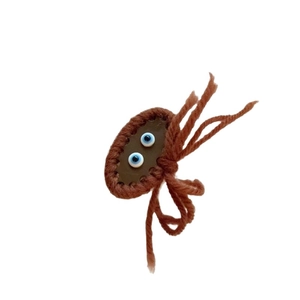 Handmade brown crochet monster hair clip with blue eyes for autumn winter hair styling