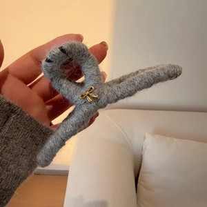 Grey plush wool hair claw clip with golden bow for women's elegant hairstyles
