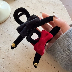 Elegant velvet bow hair claw clips in black and red with gold metal ball accents