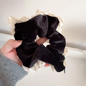 Elegant black velvet scrunchie with cream lace trim and gold charm for women