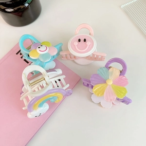 Détails de pinces à cheveux macarons colorées avec smiley rose et motifs de fleurs bleues