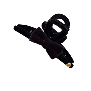 Elegant black velvet bow hair claw clip with golden bead detail for women hairstyles