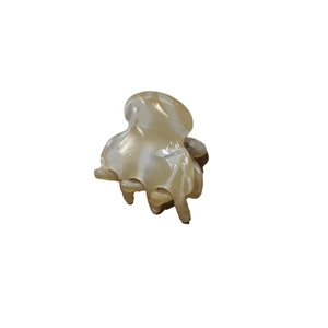 Mini acetate hair claw clip with cream marble texture for elegant hairstyles