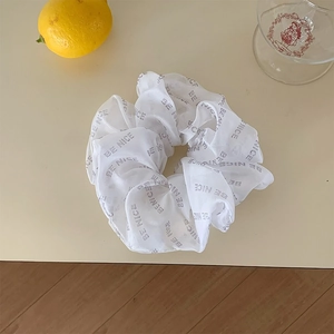 White organza scrunchie with BE NICE letter print and soft pleated mesh design