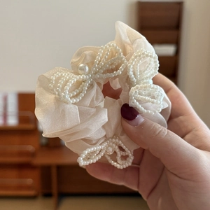 Elegant French tulle scrunchie with cream organza ruffles and white pearl bow details