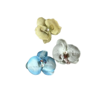 Three realistic orchid hair clips with pearls for seaside vacation and photography prop