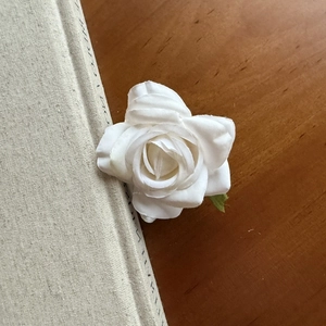 Elegant white fabric double rose flower hair clip with realistic petals and green leaves