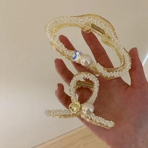 Elegant cream yellow resin hair claws with pearl embellishments and crystal accents