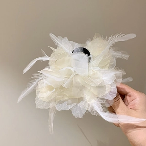 Elegant white feather bow hair claw clip with delicate mesh petals for women