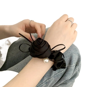 Elegant black satin rose scrunchie hair tie with a single white pearl charm for women