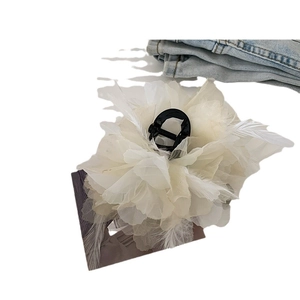 Elegant white feather bow hair claw clip with semi-transparent petals and black matte grip
