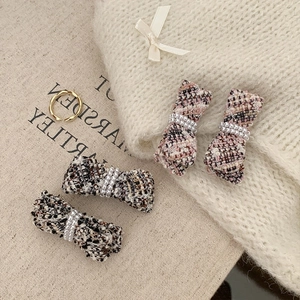 French tweed bow hair clips with pearls, available in pink-purple and black-brown sets