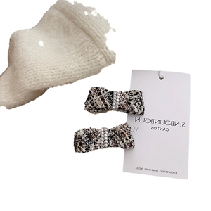 Elegant French tweed bow hair clips with pearls and gold accents for women