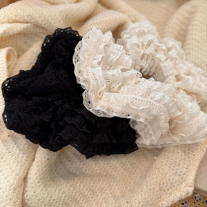 Set of black and white French lace scrunchies with layered ruffles and floral hollow patterns