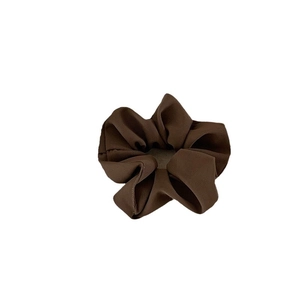 Deep brown satin scrunchie with thick ribbed texture and elastic band for women