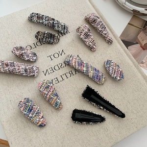 Colorful tweed knit hair clip set for women featuring elegant plaid fabric patterns