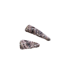 Set of two colorful tweed fabric hair clips with elegant vintage weave design