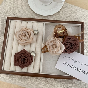 Detailed set of dried rose hair claws and clips in vintage brown and beige floral fabric