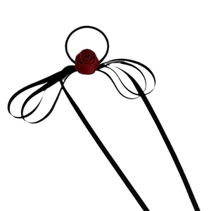 U-shaped hair pin with a deep red satin rose and black ribbons on a white background