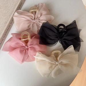 Elegant large organza bow hair claws in champagne pink black and ivory colors