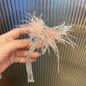 Elegant iridescent butterfly hair clip with pink feathers and long rhinestone tassels