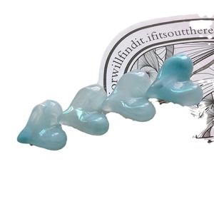 Sweet blue jelly heart hair clip for women with pearlescent resin finish on white background
