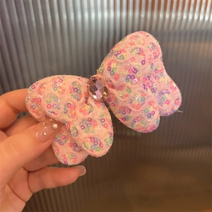 Nœud à cheveux rose à paillettes pour filles avec une grande pierre précieuse centrale