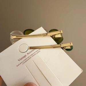 French style vintage hair clip set with green and translucent resin beads on gold clips