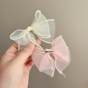 Fairy style mesh bow hair clips in creamy white and pink with wired edge details