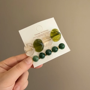 Vintage style hair clip set with green resin beads and metal pin on display card