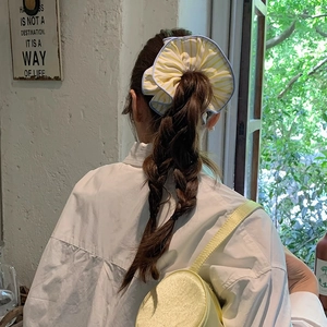 French style oversized yellow striped scrunchie on high ponytail in vintage room setting