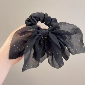 Chouchou élégant en tulle noir avec paillettes dorées pour une coiffure sophistiquée