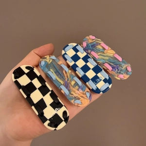 Set of four colorful checkerboard hair clips featuring trendy 3D woven resin texture