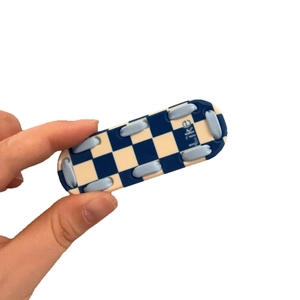 Blue and white checkerboard phone grip with woven cord detail and Like text on white background