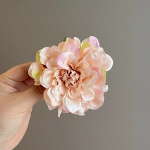 Detailed close-up of a multilayer gradient pink dahlia flower clip with soft petals