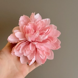 Layered pink fabric flower hair clip with realistic petals and elegant 3D design