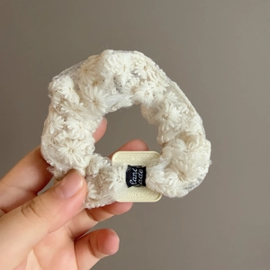 Elegant white lace floral scrunchie with embroidery and Hand Made label for ponytails